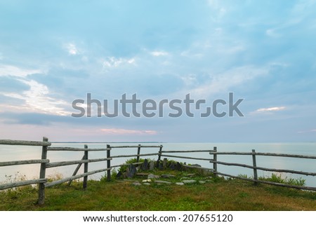 Wooden fence on ocean shore in the morning  (South Shore, Nova Scotia, Canada)