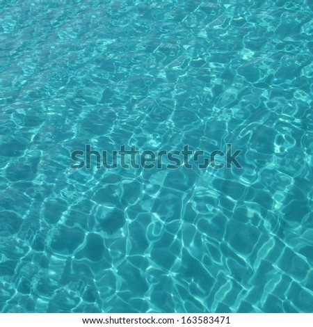 Turquoise color sea surface abstract background, with heart- shaped ripples, square dimensions