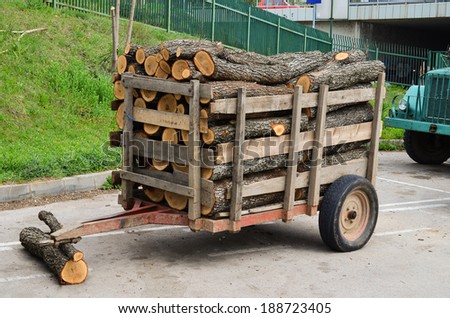 Small quantity of oak tree firewood in the tractor trailer, waiting on the marketplace for customer