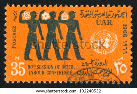 EGYPT - CIRCA 1966: stamp printed by Egypt, shows Workers and UN emblem, circa 1966