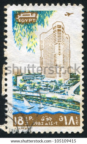 EGYPT - CIRCA 1982: stamp printed by Egypt, shows Tower Hotel, city, sailboats, circa 1982