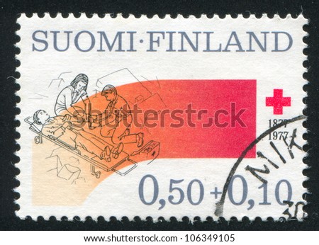 FINLAND - CIRCA 1977: A stamp printed by Finland, shows Disaster Relief, circa 1977