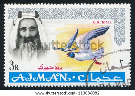 AJMAN - CIRCA 1964: stamp printed by Ajman, shows Sheik Rashid bin Humaid al Naimi and bird, circa 1964