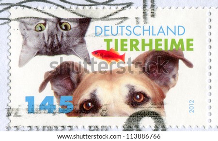 GERMANY - CIRCA 2012: stamp printed by Germany, shows cat and dog, circa 2012