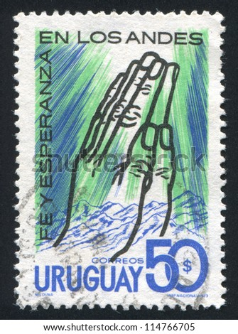 URUGUAY - CIRCA 1973: stamp printed by Uruguay, shows Praying Hands and Andes, circa 1973