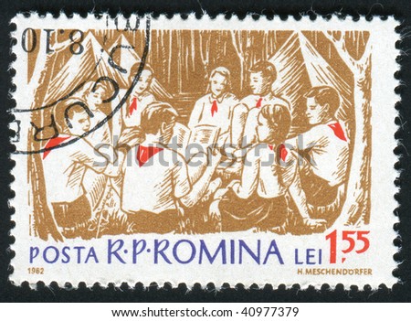 ROMANIA - CIRCA 1962: The Romanian pioneers read the book, circa 1962.