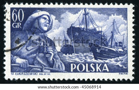POLAND - CIRCA 1956: The fisherman with the field-glass in hands, circa 1956.