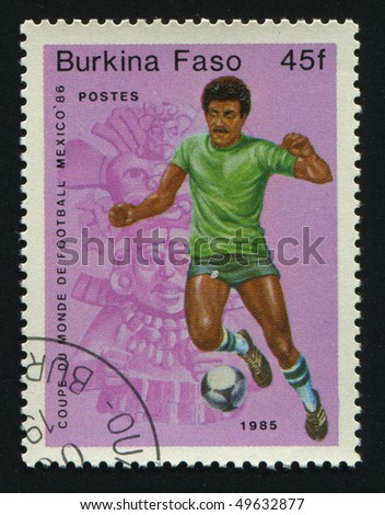 BURKINA FASO - CIRCA 1986: stamp printed by Burkina Faso, shows soccer players and ball. Championships Mexico, circa 1986.
