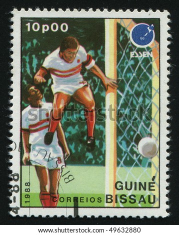 GUINEA-BISSAU - CIRCA 1988: stamp printed by Guinea - Bissau, shows soccer players and ball. 1988 Sumer olimpics, Seoul, circa 1988.