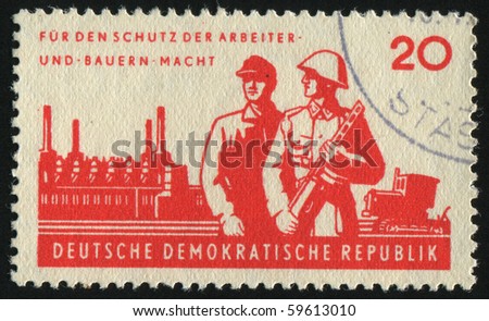 GERMANY- CIRCA 1962: stamp printed by Germany, shows soldier and worker, circa 1962