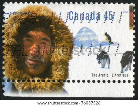 CANADA - CIRCA 1995: stamp printed by Canada, shows Inuk man, igloo, sled dogs, circa 1995