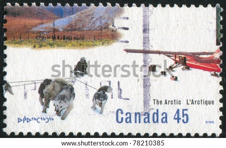 CANADA - CIRCA 1995: A stamp printed by Canada, shows Dog-sled team, ski plane, circa 1995