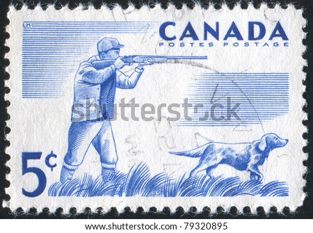 CANADA - CIRCA 1957: stamp printed by Canada, shows Hunter and dog, circa 1957