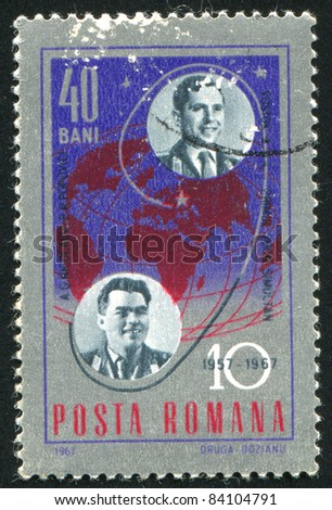 ROMANIA - CIRCA 1967: stamp printed by Romania, shows Andrian G. Nikolayev, Pavel R. Popovich and globe with trajectory of Vostok 8, circa 1967