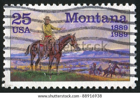 UNITED STATES- CIRCA 1989: A stamp printed by United States, shows cowboys riding over the state Montana, circa 1989