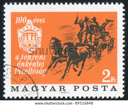 HUNGARY - CIRCA 1966: A stamp printed by Hungary, shows Horse-drawn fire pump and emblem of Sopron Fire Brigade, circa 1966