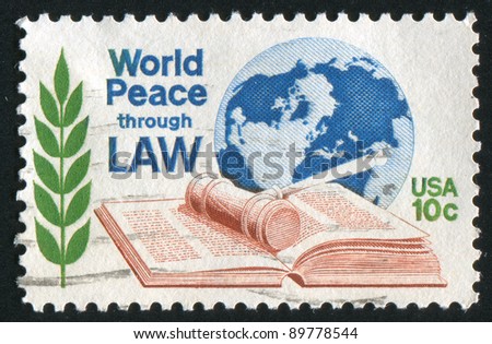 UNITED STATES - CIRCA 1975: stamp printed by United States of America, shows law book, olive branch and globe, circa 1975