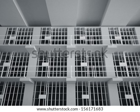 The view from the inside of a brick jail cell with iron bars.