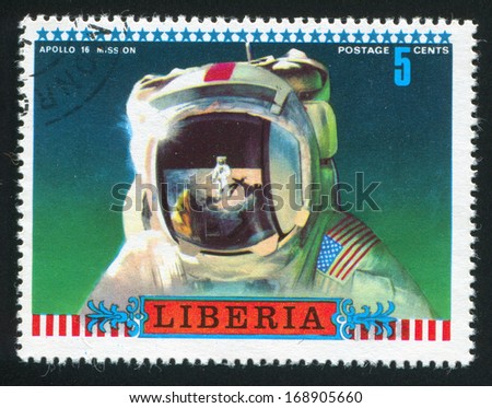 LIBERIA - CIRCA 1972: stamp printed by Liberia, shows Moon scene reflected in astronauts helmet, circa 1972