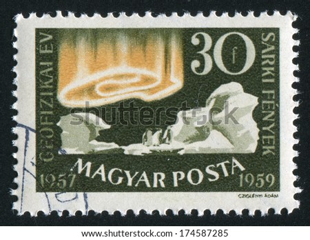HUNGARY Ã?Â¢?? CIRCA 1959: stamp printed by Hungary, shows iceberg, penguin and polar light, circa 1959