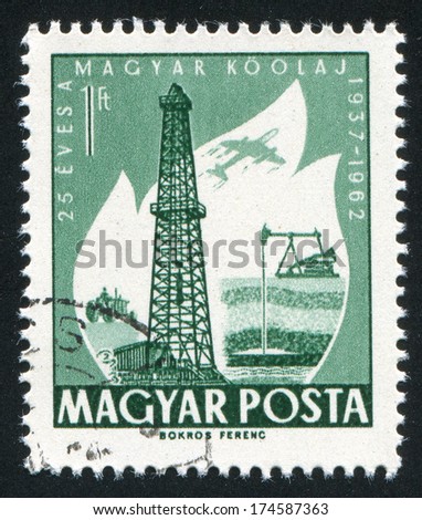 HUNGARY Ã?Â¢?? CIRCA 1962: stamp printed by Hungary, shows Oil Derrick and Primitive Oil well, circa 1962