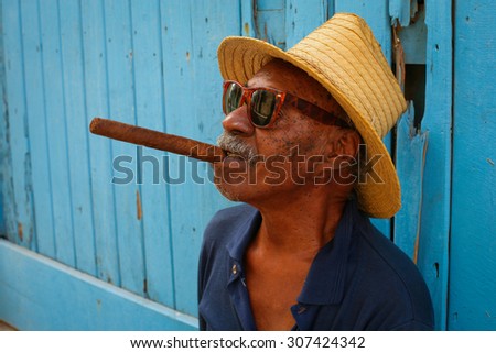 Cuba Havana 2005 Year December 10 .Old man with big cigar on the Havana street