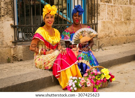 Cuba Havana 2005 Year December 12 . Two cuban woman in traditional cuban dress on the Havana street