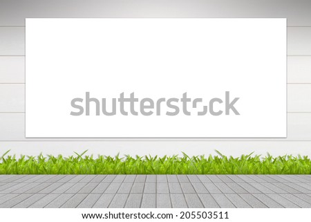 Banner advertising a large signs with isolated white space on grass and mortar wall