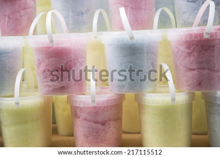 Cotton candy in plastic baskets as background