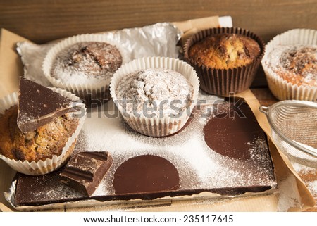 Chocolate cupcakes on a dark chocolate bar