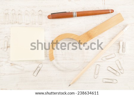Stationery equipments on a white wooden background