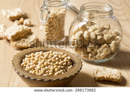 Soy protein and beans on a wooden background