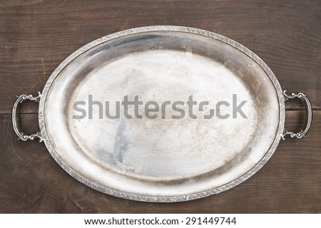 Vintage tray on a wooden background