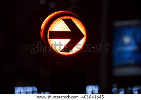 Red traffic light with the arrow