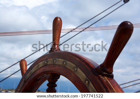 Wooden steering wheel of the sailboat