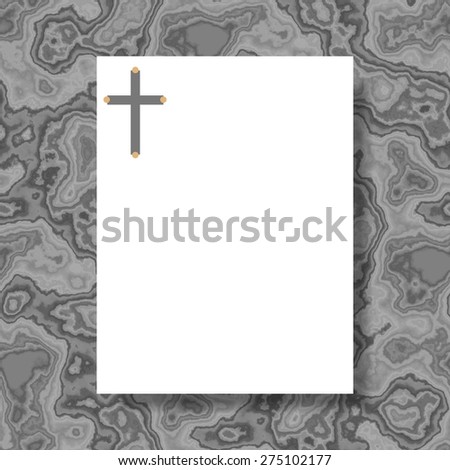 White writing paper with cross in header lying on gray marble board