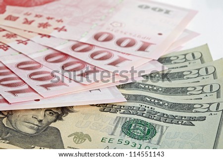 six piece of one hundred dollar of  New Taiwan Dollar cash and five piece of twenty  dollars of US case with white backuground close up