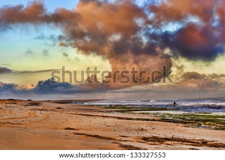 Fisherman with fishing rod on the beach, western sahara coast