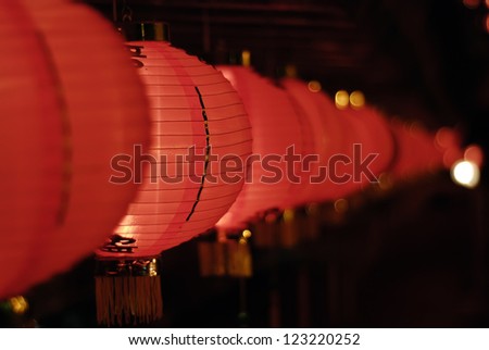 A row of Chinese red lanterns at night