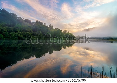 Sunrise by the lakeside with beautiful reflection