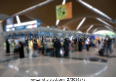 Blur image of people at busy airport terminal
