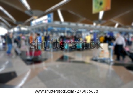 Blur image of people at busy airport terminal