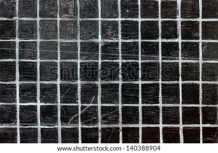 Old school black board in the white cell abstract background