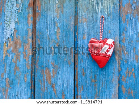 Heart on blue woody background