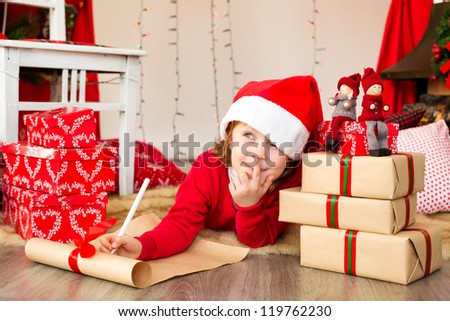 Girl writing a christmas wish list