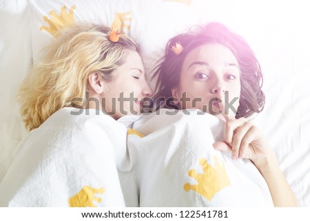 two girls are staying up