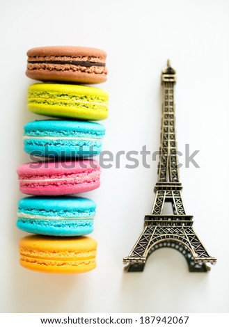 Traditional french colorful macarons wuth the symbol of Paris