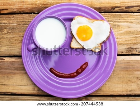 Cute breakfast with milk, jam and egg in a heart shape for you