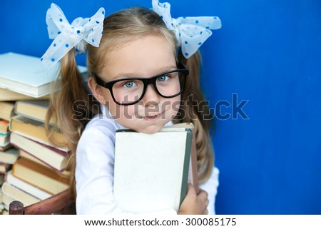 The girl with the books preparing to the new school year