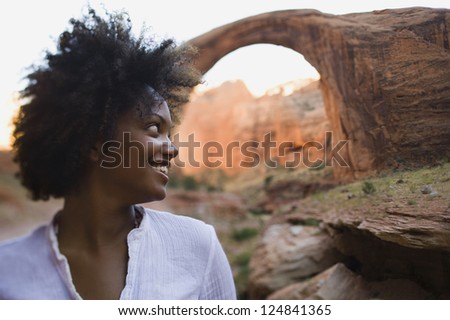 Portrait of African American female tourist smiling